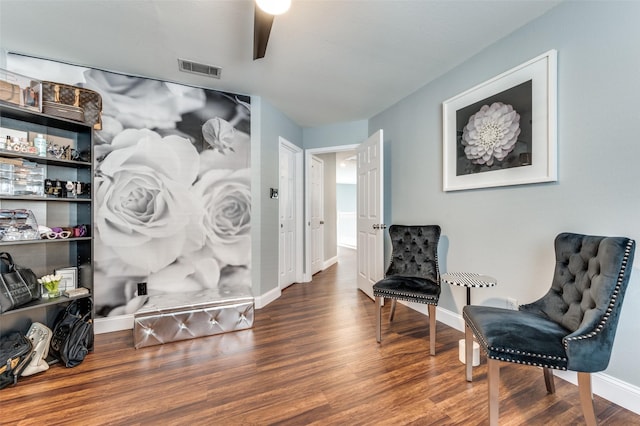 sitting room with hardwood / wood-style floors