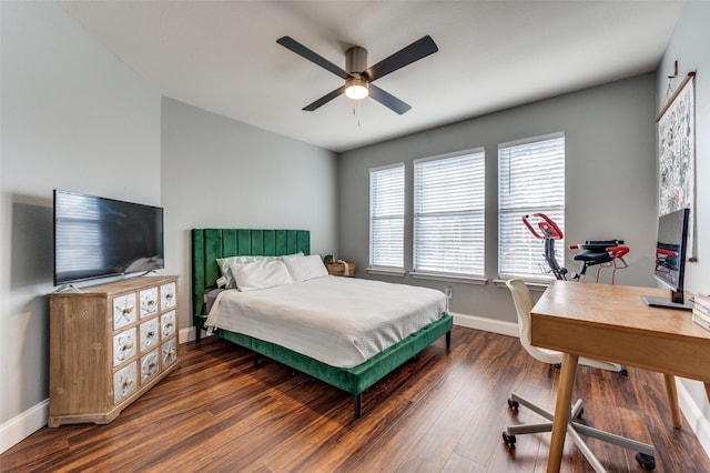 bedroom with dark hardwood / wood-style flooring and ceiling fan