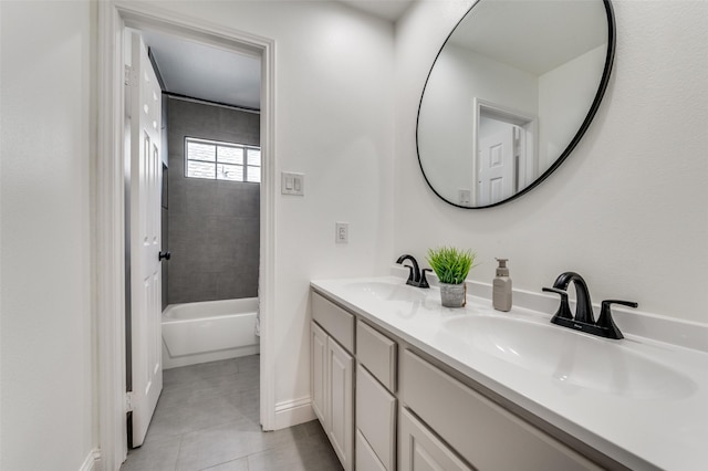 bathroom with tile patterned floors, tiled shower / bath combo, and vanity