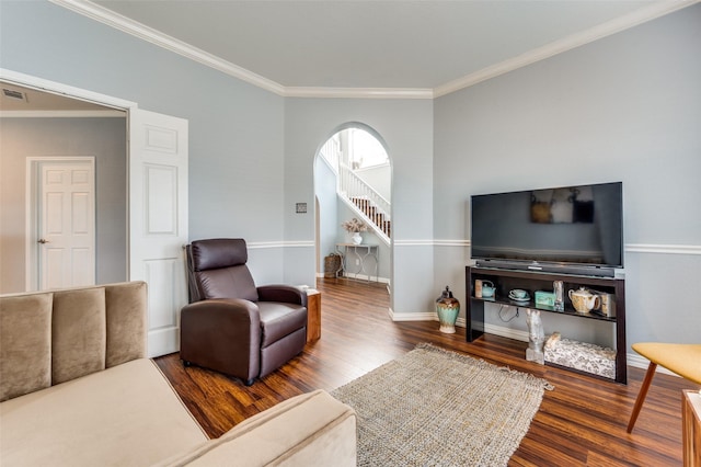 living room featuring hardwood / wood-style floors and crown molding