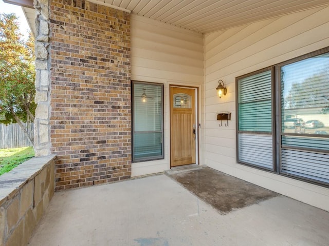 entrance to property featuring a patio