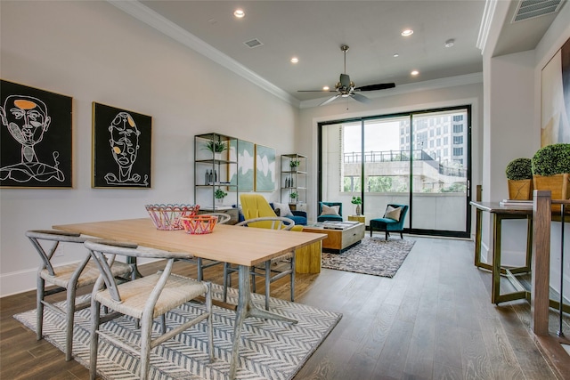 dining space with ceiling fan, hardwood / wood-style flooring, and crown molding