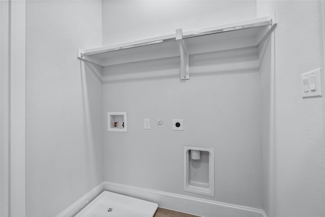 washroom with washer hookup, hookup for an electric dryer, hookup for a gas dryer, and wood-type flooring