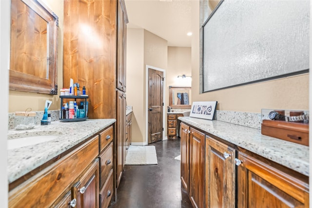 bathroom featuring sink and concrete floors