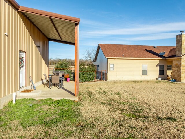 view of outbuilding featuring a yard