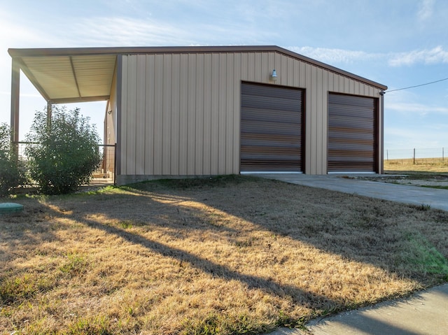 garage featuring a yard