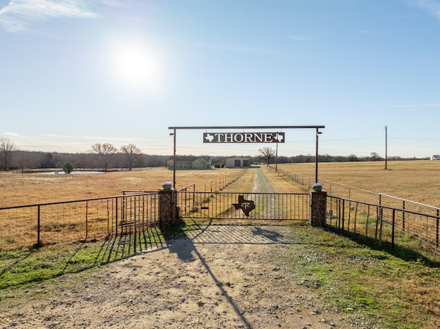 view of yard with a rural view