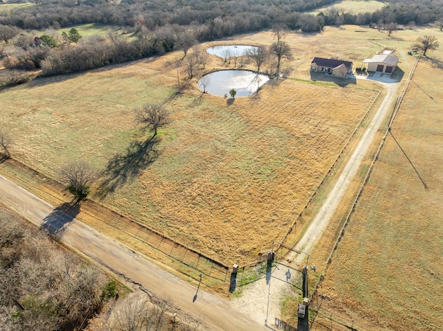 birds eye view of property featuring a rural view and a water view