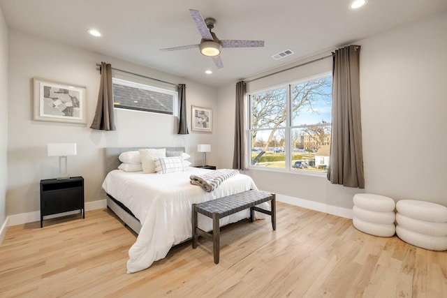 bedroom with ceiling fan and light hardwood / wood-style flooring