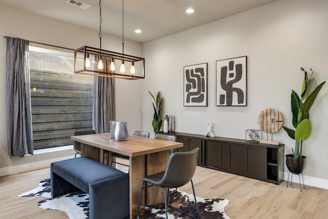 dining area with light hardwood / wood-style floors