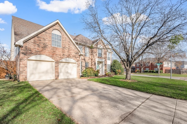 view of front facade with a front lawn and a garage