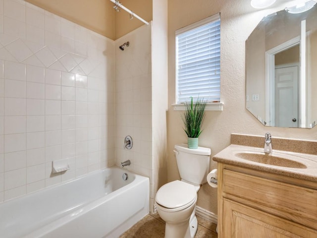 full bathroom featuring vanity, toilet, and tiled shower / bath combo