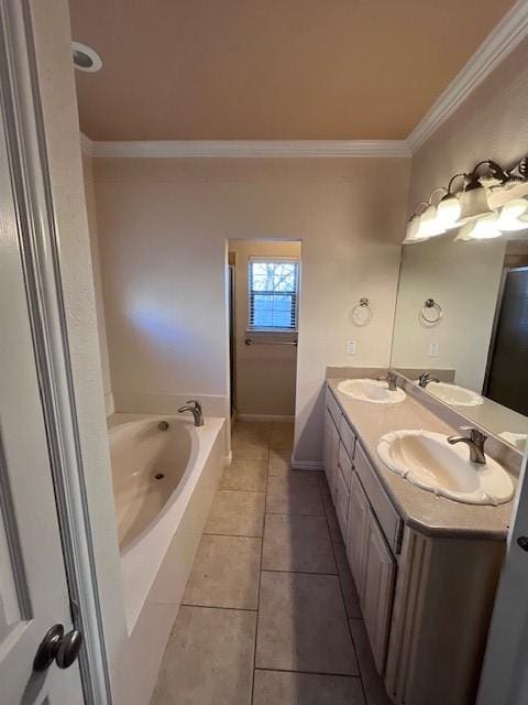 bathroom featuring vanity, tile patterned flooring, ornamental molding, and a bathtub