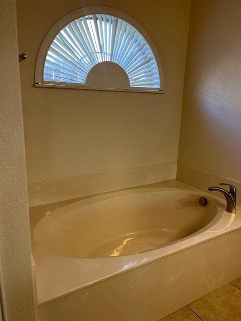 bathroom featuring a bathing tub and tile patterned floors