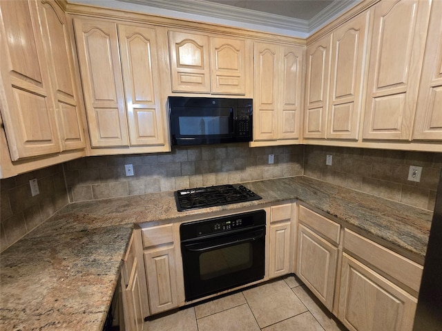 kitchen featuring light brown cabinetry, light tile patterned floors, dark stone countertops, and black appliances