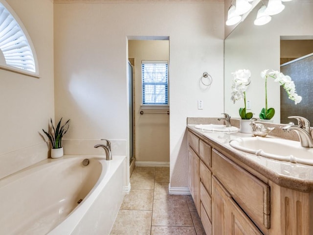 bathroom with tile patterned flooring, vanity, and independent shower and bath