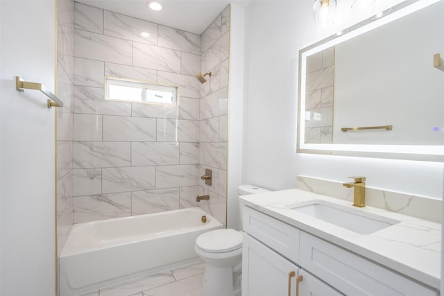 full bathroom featuring toilet, vanity, and tiled shower / bath