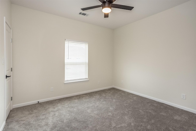 spare room with carpet floors and ceiling fan