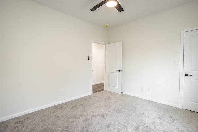 carpeted empty room with ceiling fan