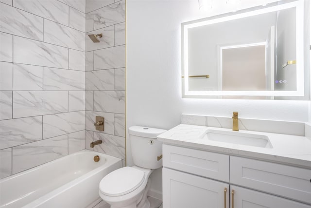 full bathroom featuring toilet, tiled shower / bath combo, and vanity