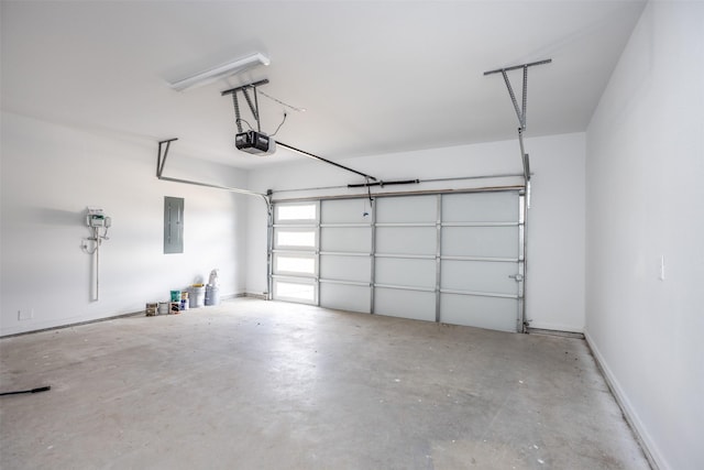 garage featuring a garage door opener and electric panel