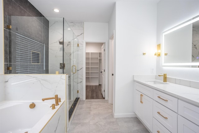 bathroom featuring vanity and separate shower and tub