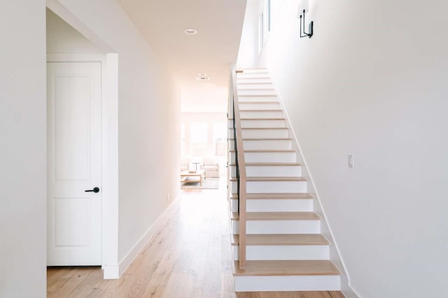 stairway featuring hardwood / wood-style floors