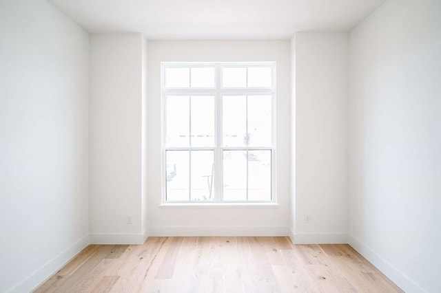 spare room featuring light hardwood / wood-style flooring