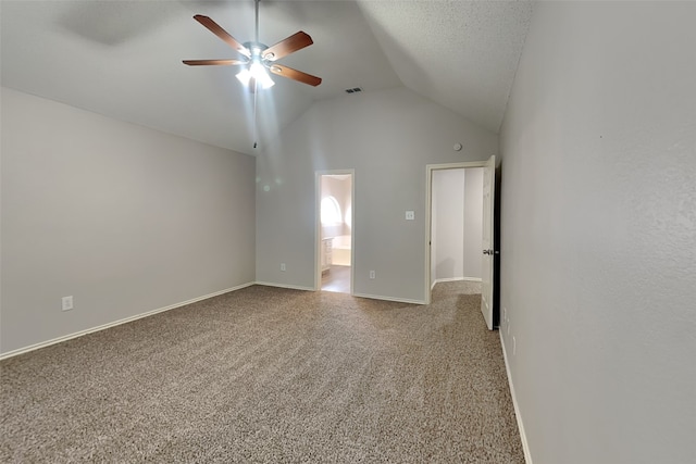 carpeted empty room featuring high vaulted ceiling, a textured ceiling, and ceiling fan