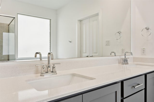 bathroom featuring vanity and a shower with shower door