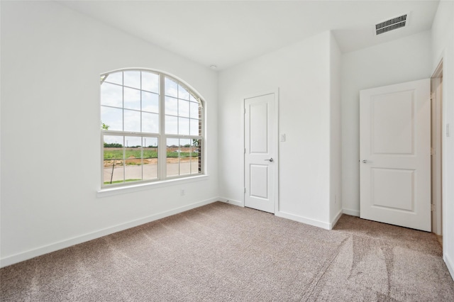 unfurnished bedroom with a closet and carpet flooring