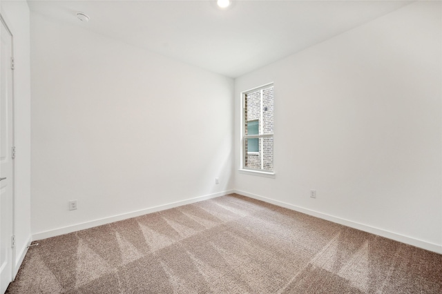 unfurnished room featuring carpet floors