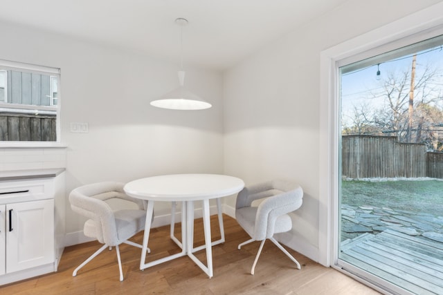 dining space featuring light wood-type flooring