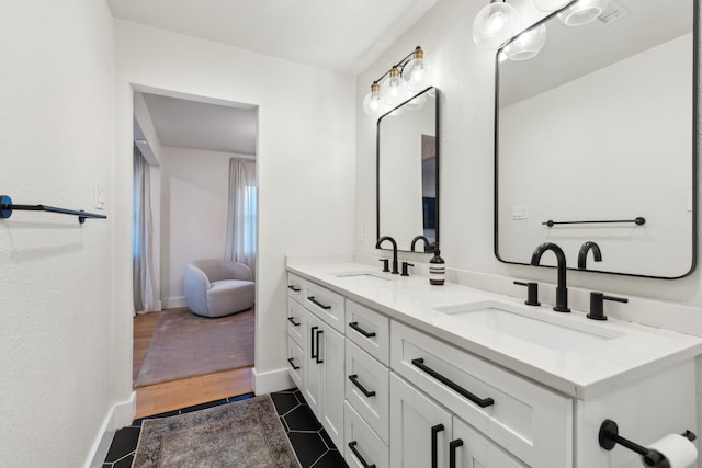 bathroom featuring tile patterned floors and vanity