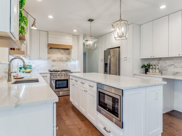 kitchen featuring stainless steel appliances and white cabinetry