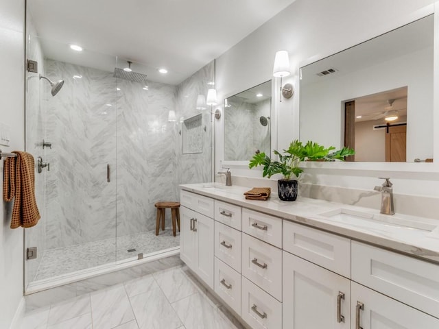 bathroom with walk in shower and vanity