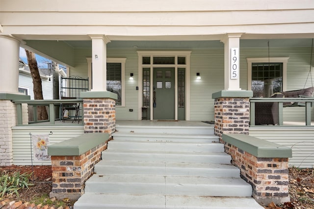 entrance to property featuring a porch