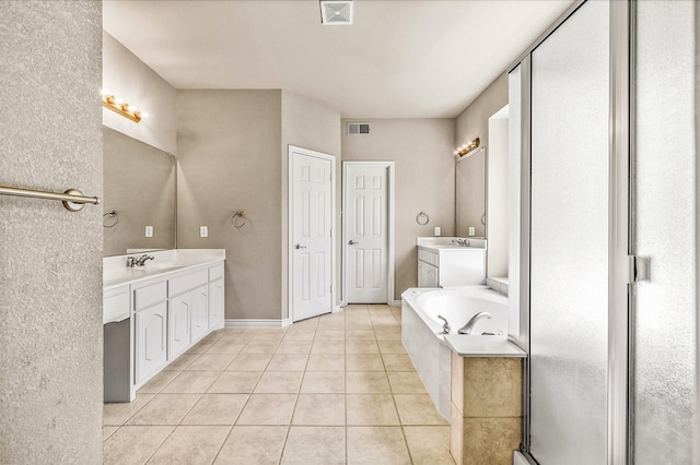 bathroom with tile patterned flooring, plus walk in shower, and vanity