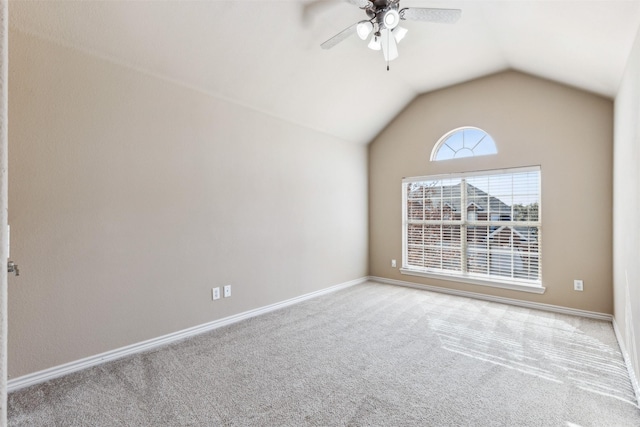 carpeted empty room with ceiling fan and lofted ceiling