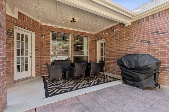 view of patio featuring a grill