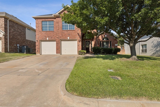 view of front of property with a front lawn, central AC unit, and a garage