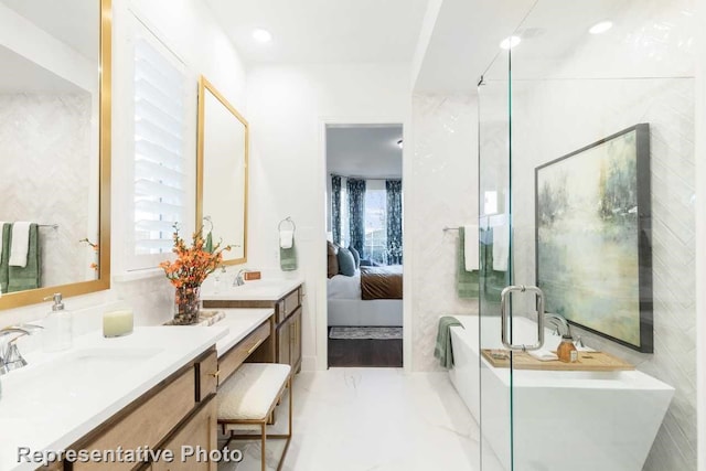 bathroom with vanity and a tub to relax in