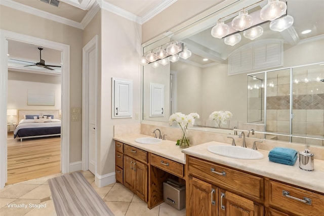 bathroom with vanity, tile patterned flooring, ceiling fan, and ornamental molding