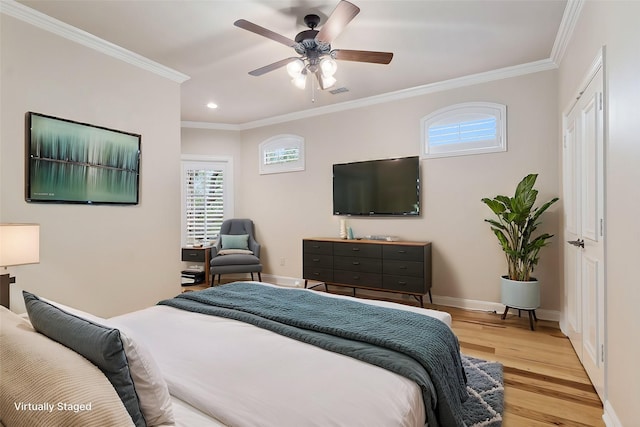 bedroom featuring light wood-type flooring, ceiling fan, and crown molding