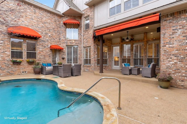 view of pool with an outdoor hangout area and a patio area