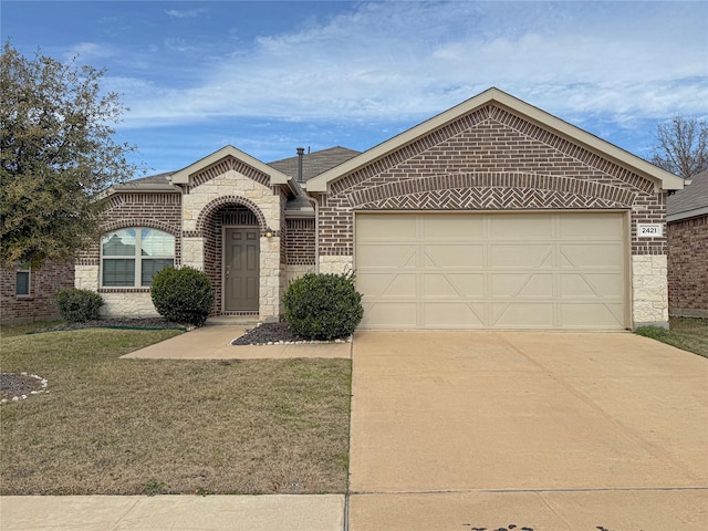 view of front facade with a front yard and a garage