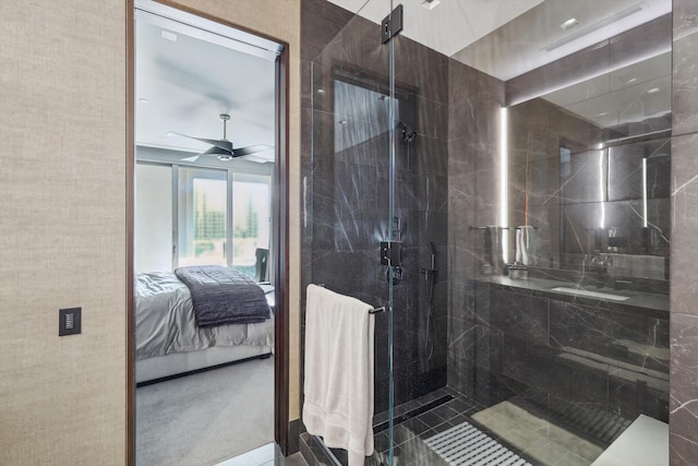 bathroom with an enclosed shower and ceiling fan