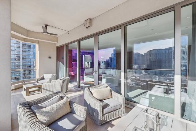 view of patio / terrace with ceiling fan and an outdoor hangout area