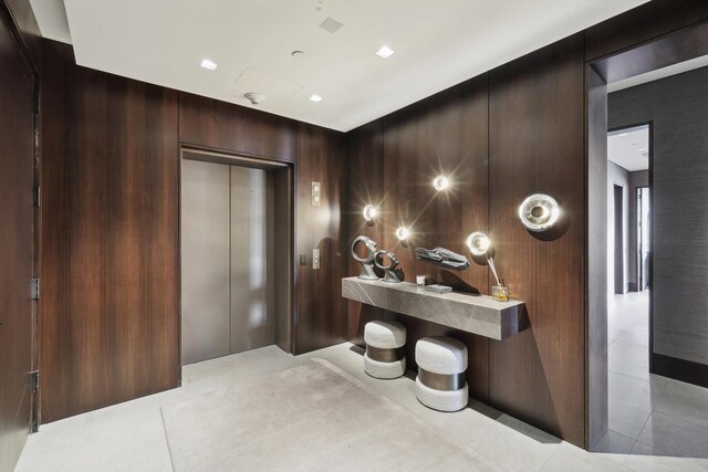 hallway with sink and expansive windows