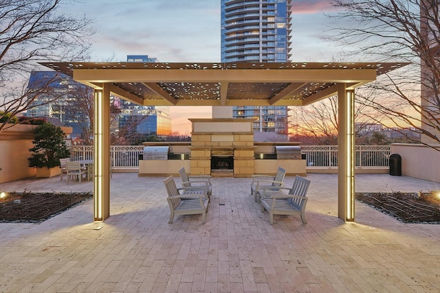 patio terrace at dusk with exterior kitchen